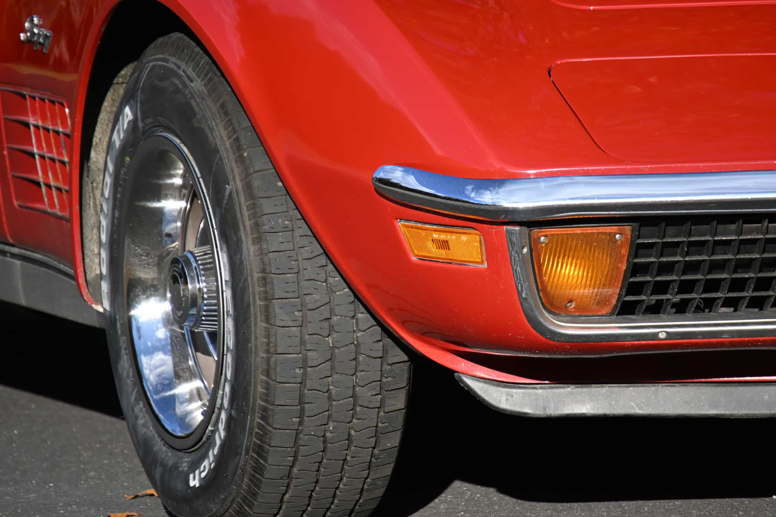 1972 Chevrolet corvette — Close-up of classic car front wheel and bumper detail.