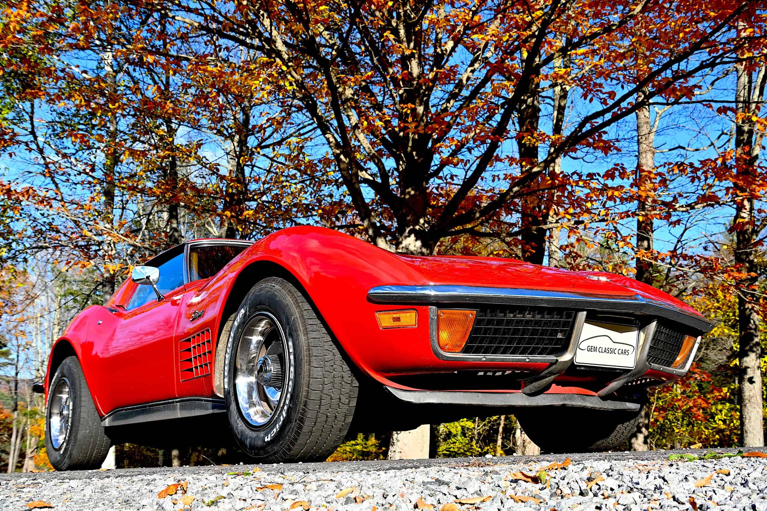 1972 Chevrolet corvette — Red classic car with open top in autumn forest setting.