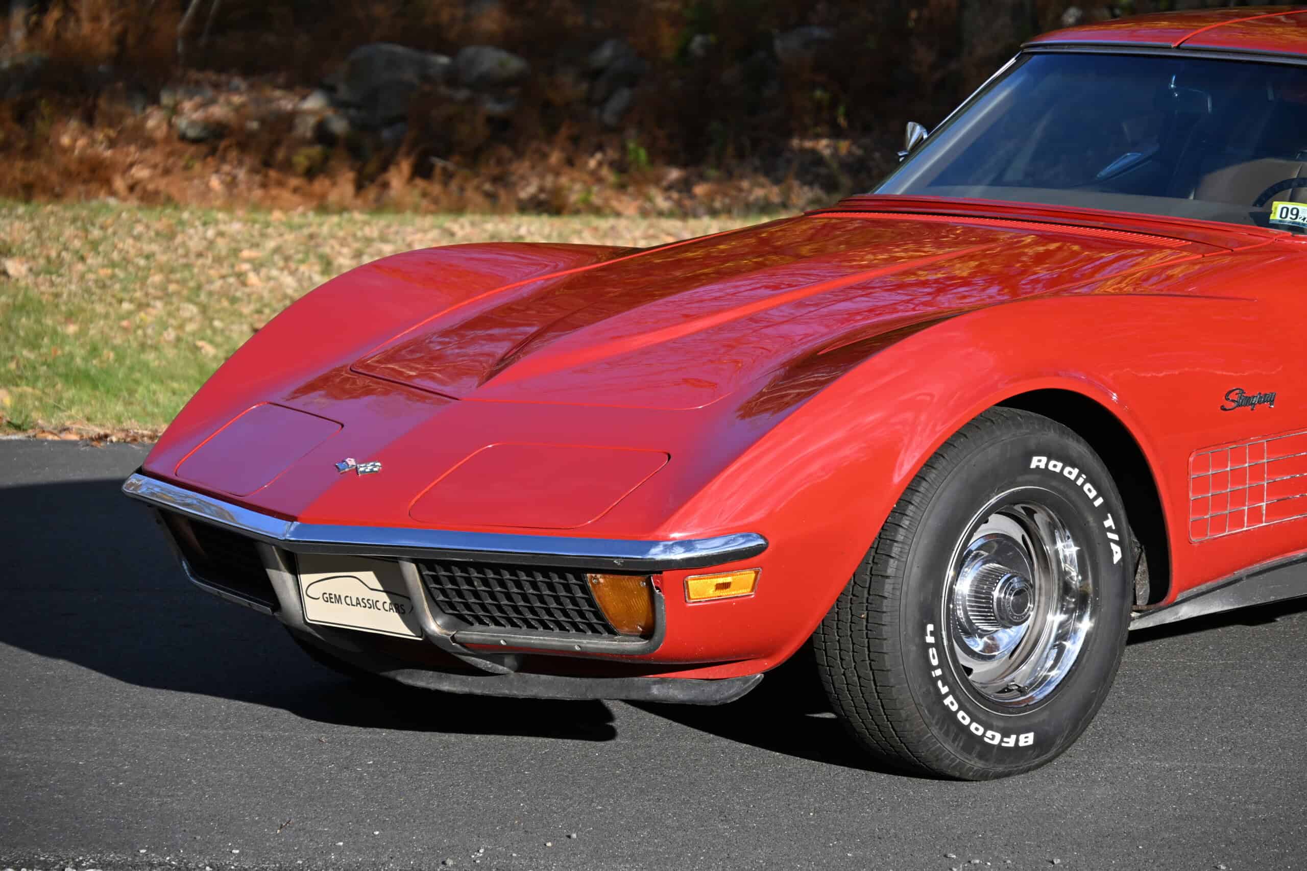 1972 Chevrolet corvette — Red classic car with sporty design and chrome wheels.