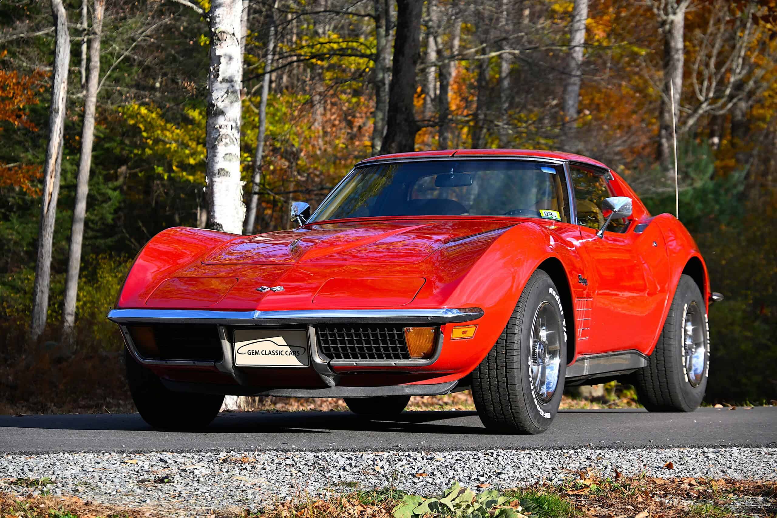 1972 Chevrolet corvette — Red classic car with sleek body and sporty design on road.