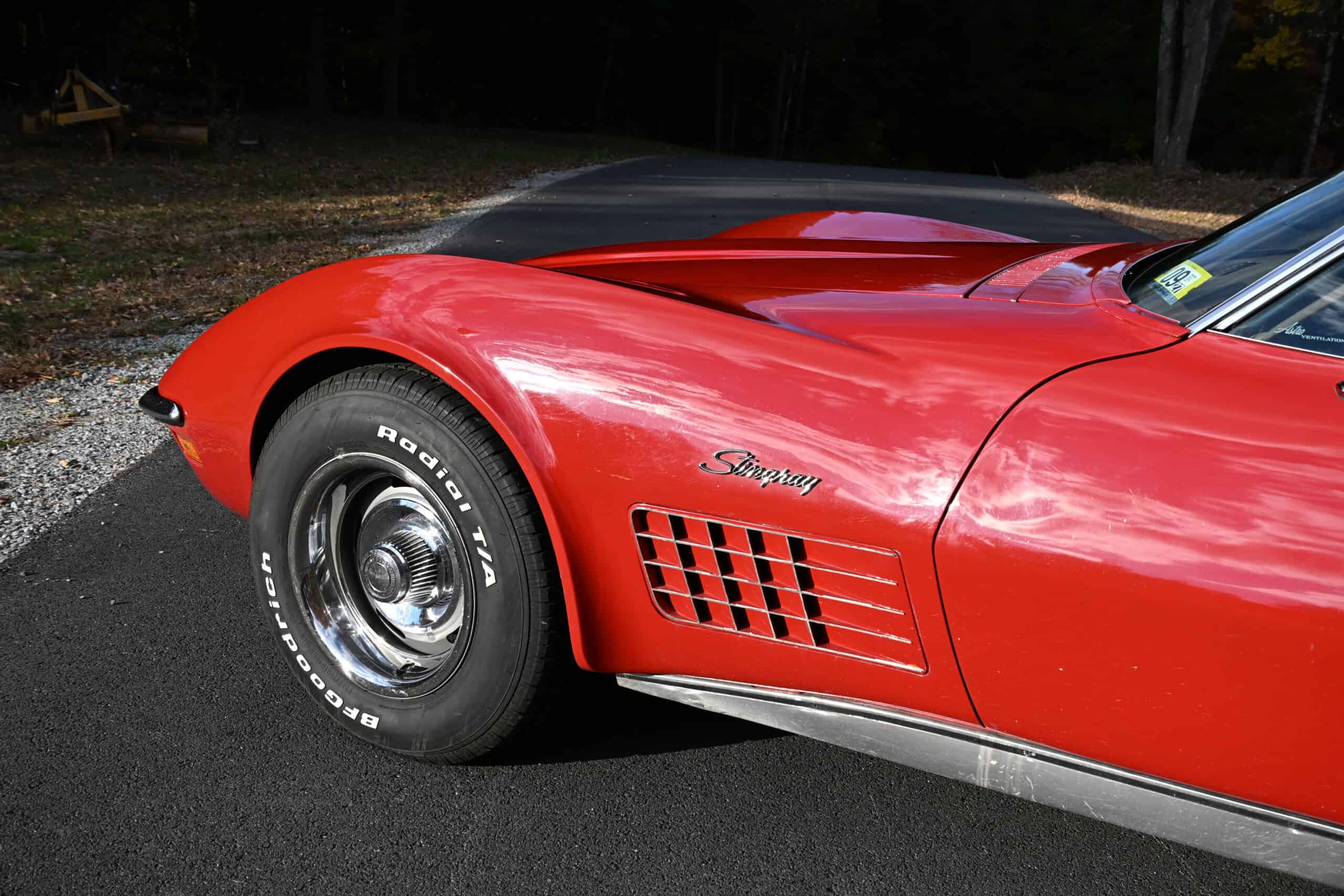 1972 Chevrolet corvette — Red classic car with detailed body and wheel close-up.