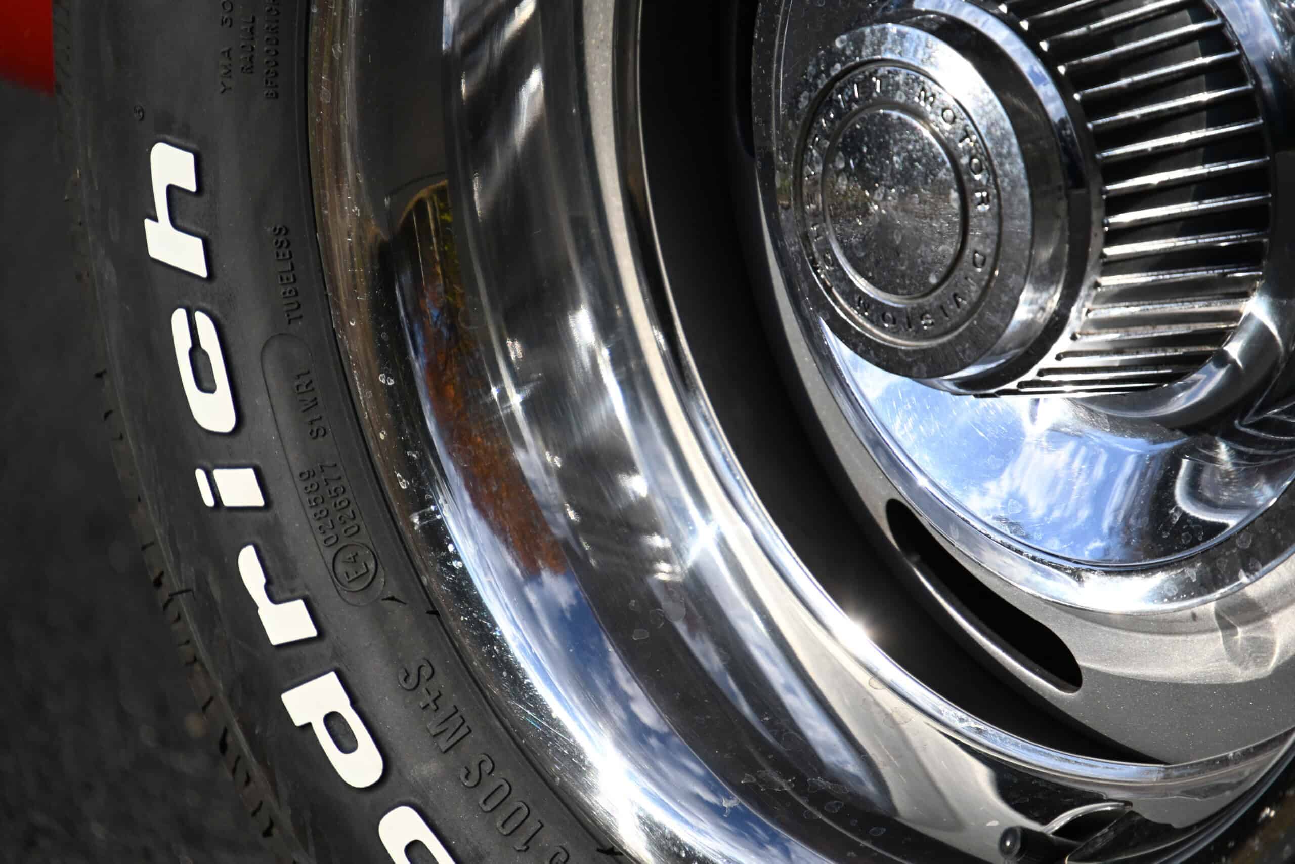 1972 Chevrolet corvette — Detail of classic car wheel with chrome rim and tire tread.
