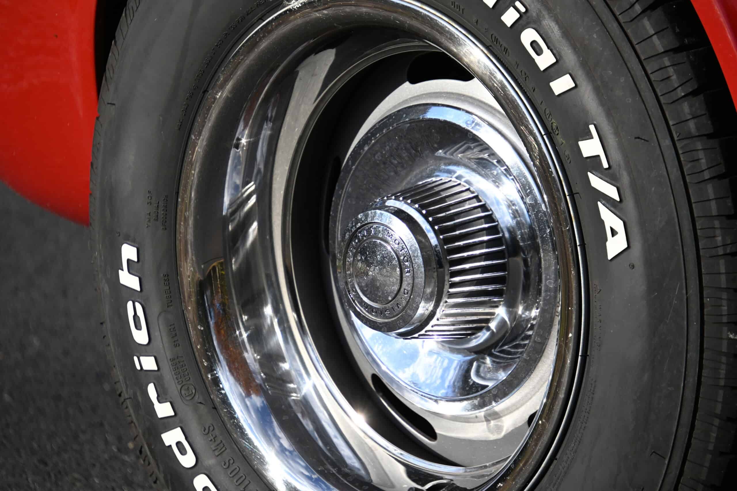 1972 Chevrolet corvette — Close-up of a classic car wheel with chrome hubcap and tire.