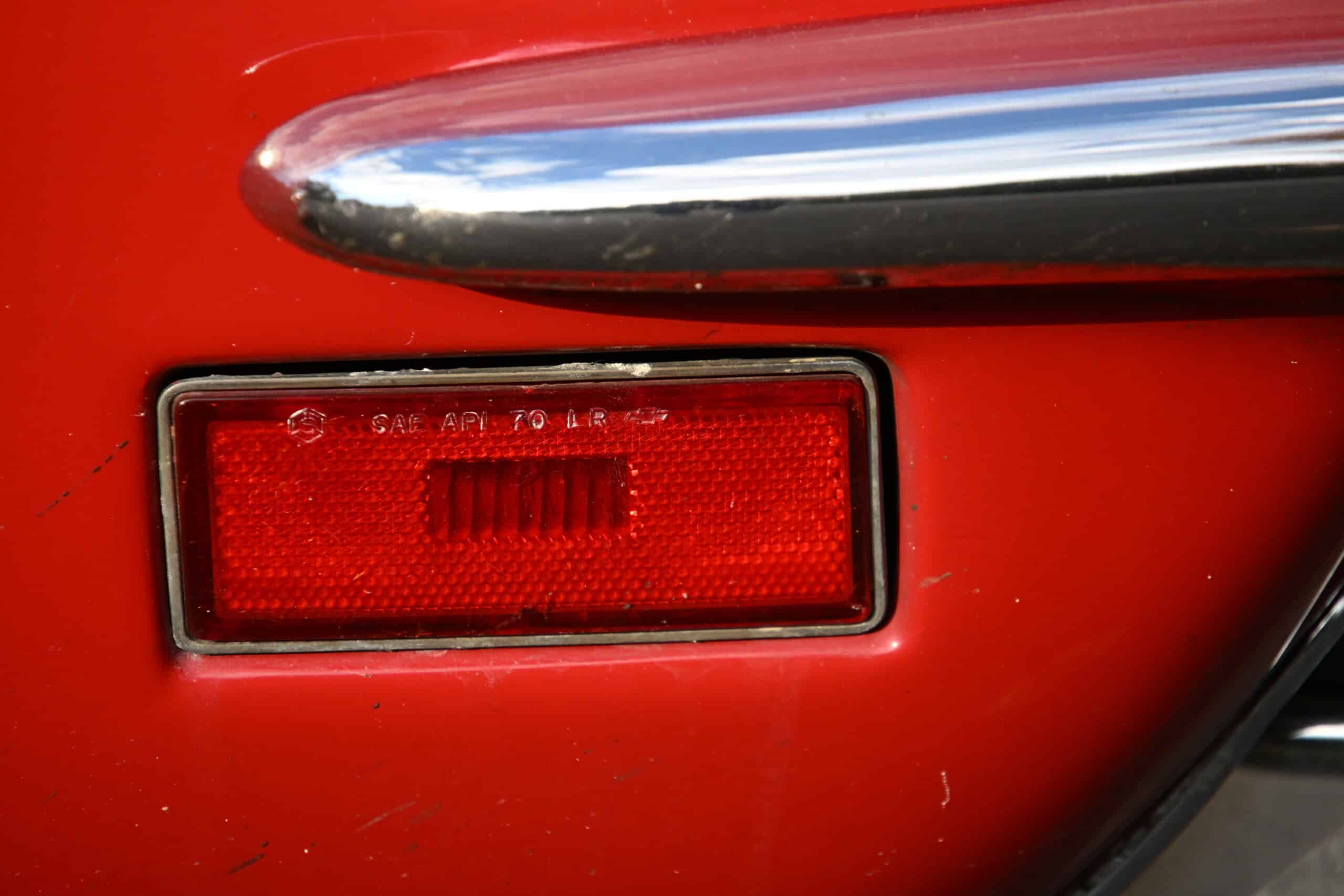 1972 Chevrolet corvette — Close-up of red rear light and chrome bumper of classic car.