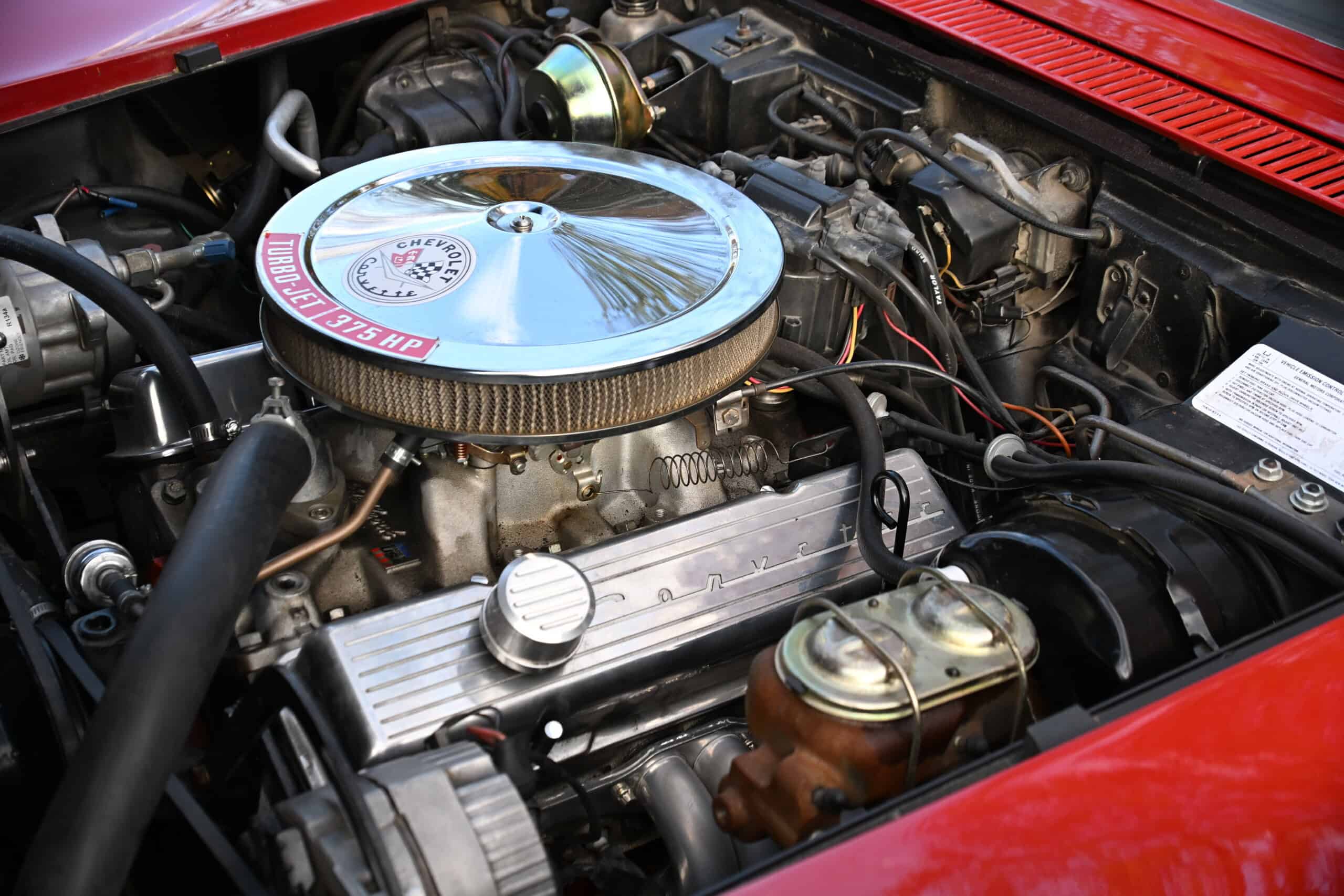 1972 Chevrolet corvette — Close-up of classic car engine with chrome air filter and engine components.