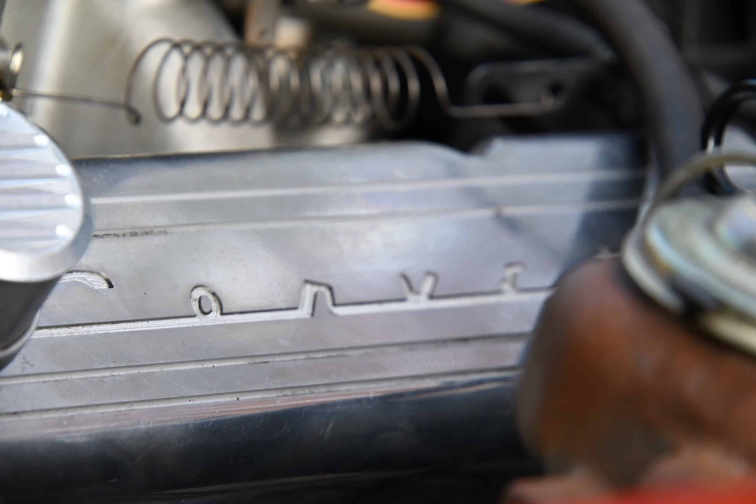 1972 Chevrolet corvette — Close-up of classic car engine with visible components and metallic finish.