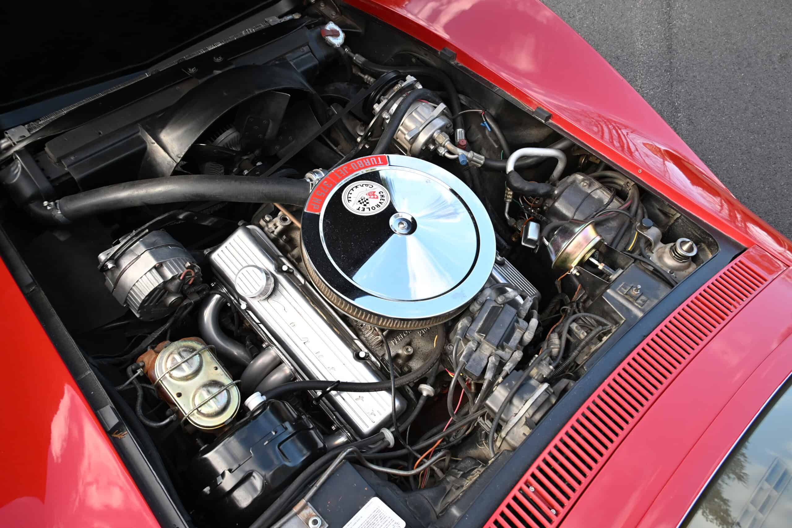 1972 Chevrolet corvette — Close-up of classic car engine with chrome air filter and components.