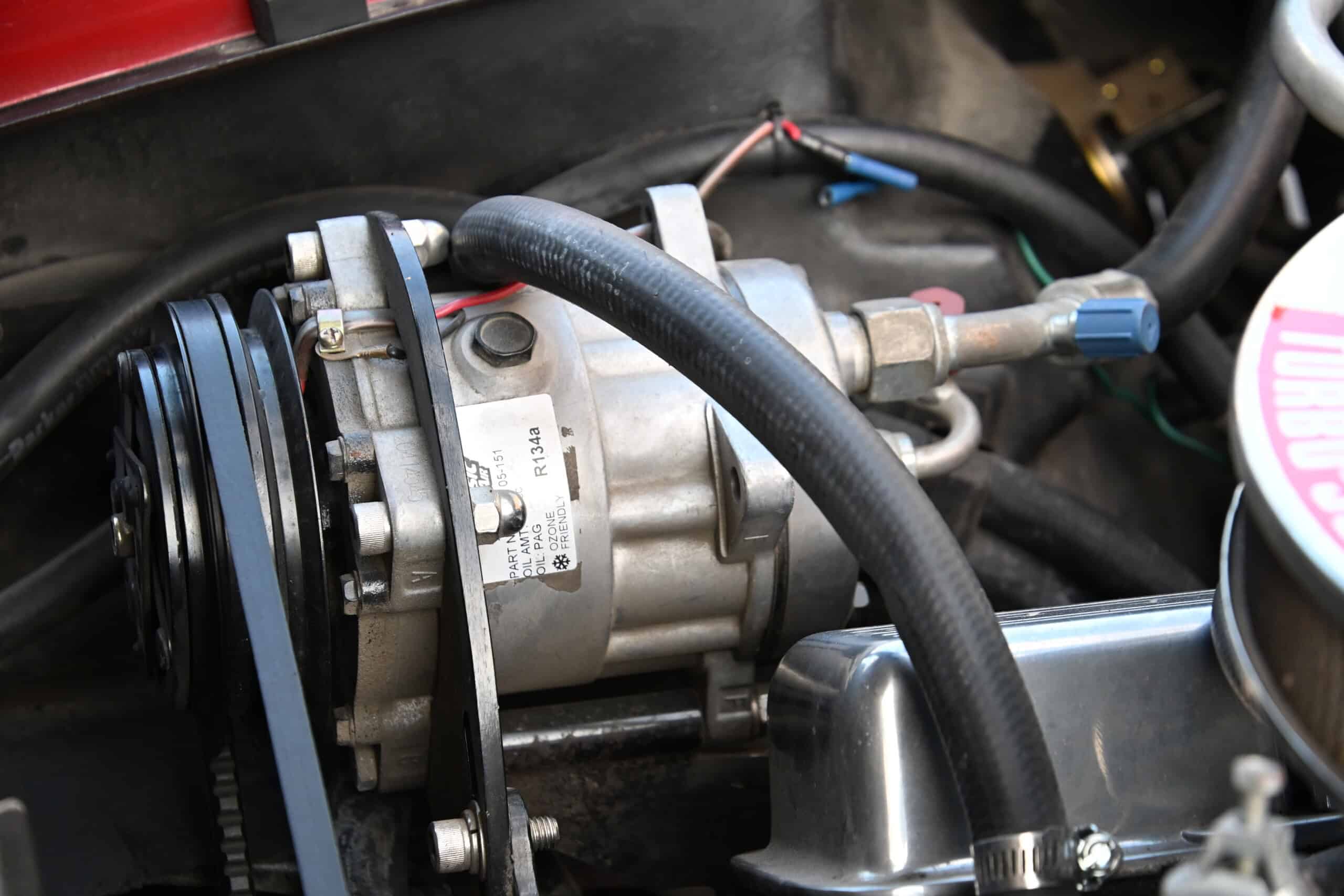 1972 Chevrolet corvette — Close-up of engine with belts and hoses in a classic car.