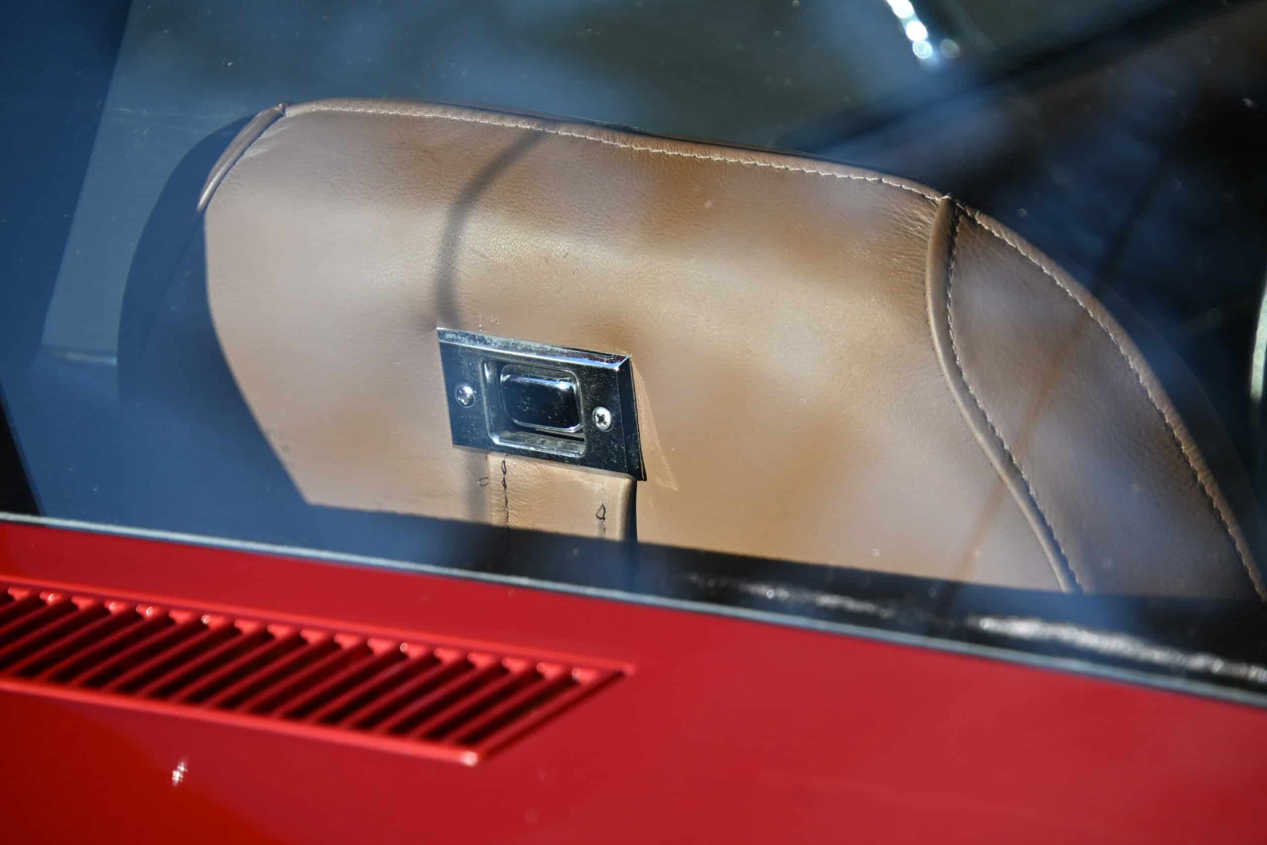 1972 Chevrolet corvette — Interior view of a classic car with beige headrest and rear window.