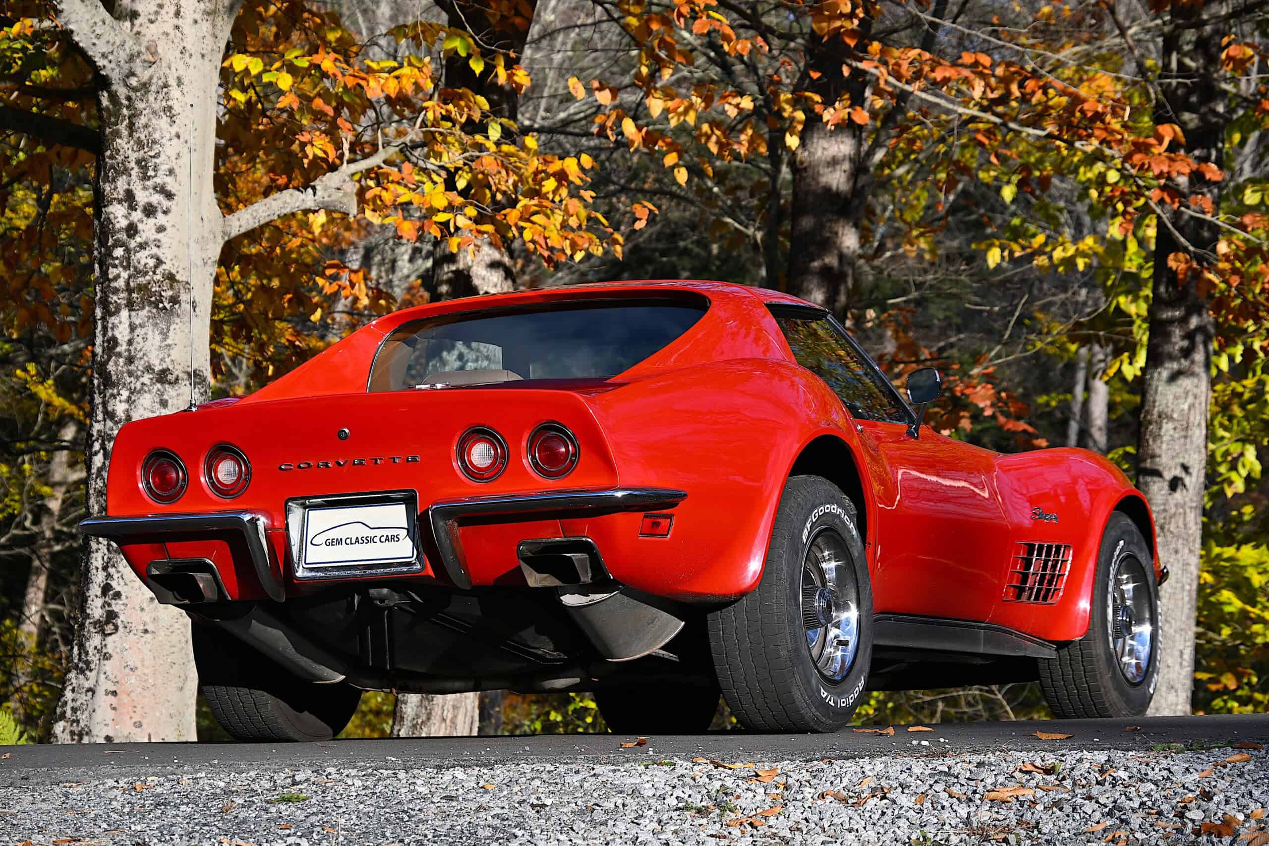 1972 Chevrolet corvette — Red classic car exterior shot with autumn trees in background.