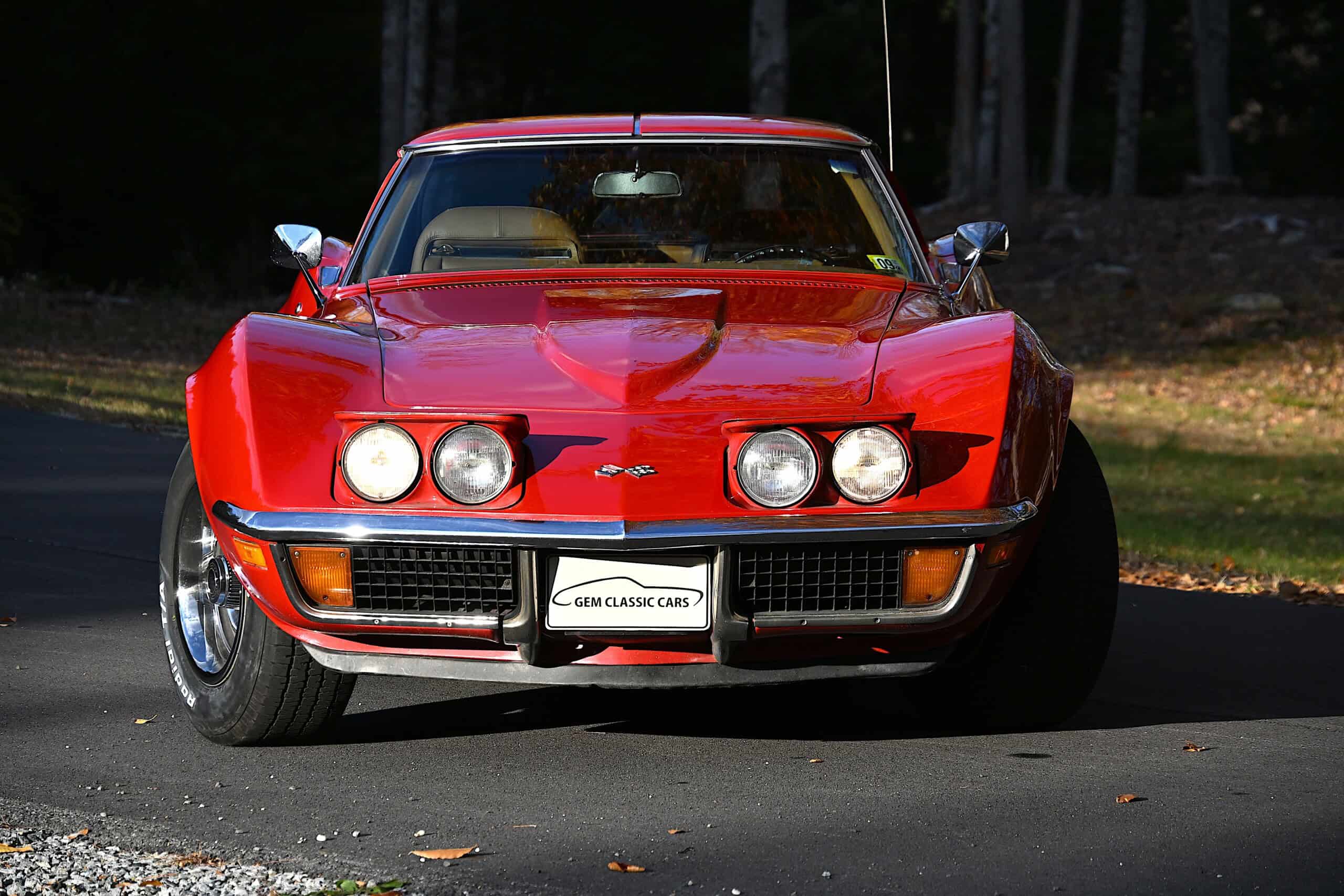 1972 Chevrolet corvette — Front view of a red classic car with round headlights and sleek body.