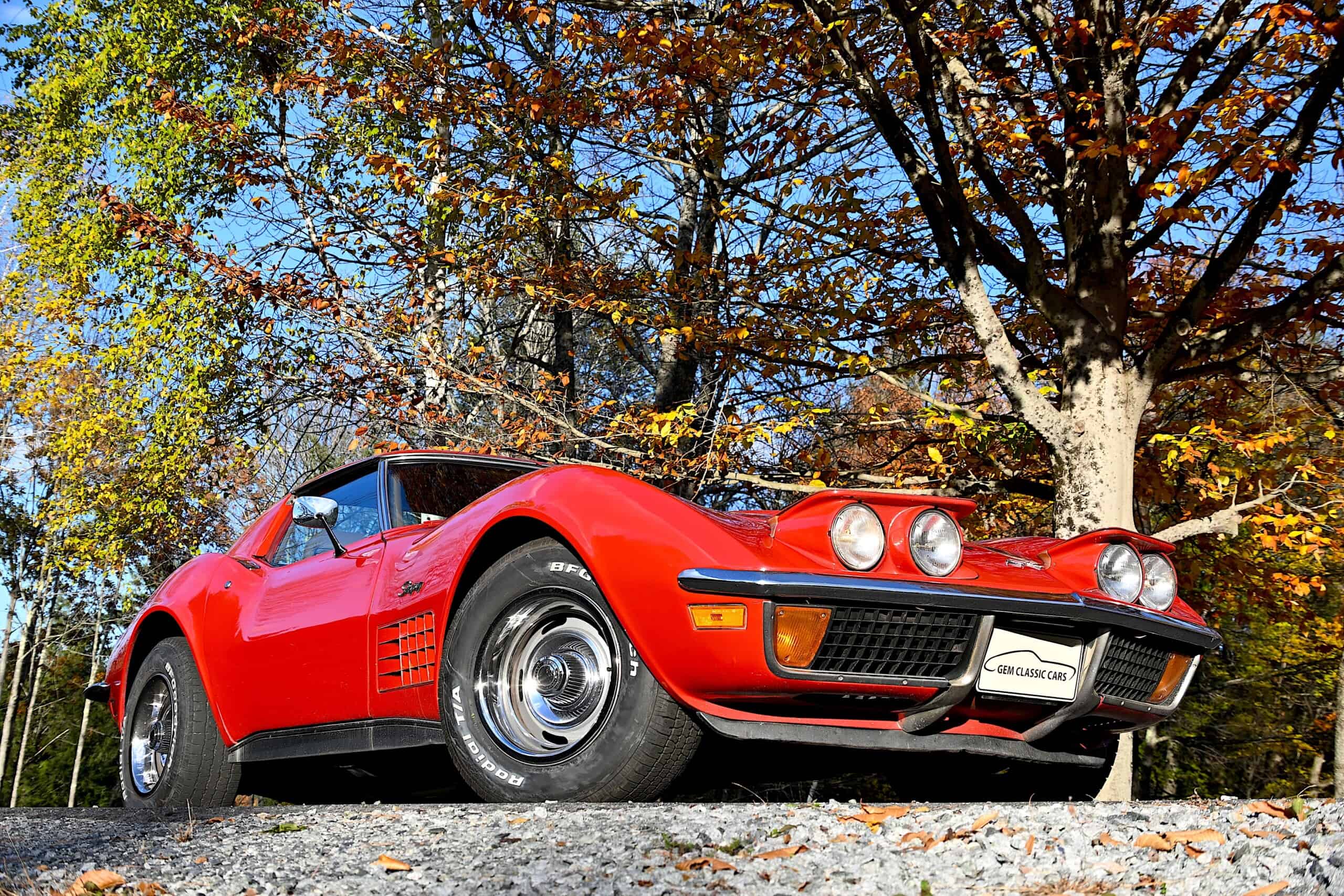 1972 Chevrolet corvette — Red classic car with sleek body and round headlights outdoors.