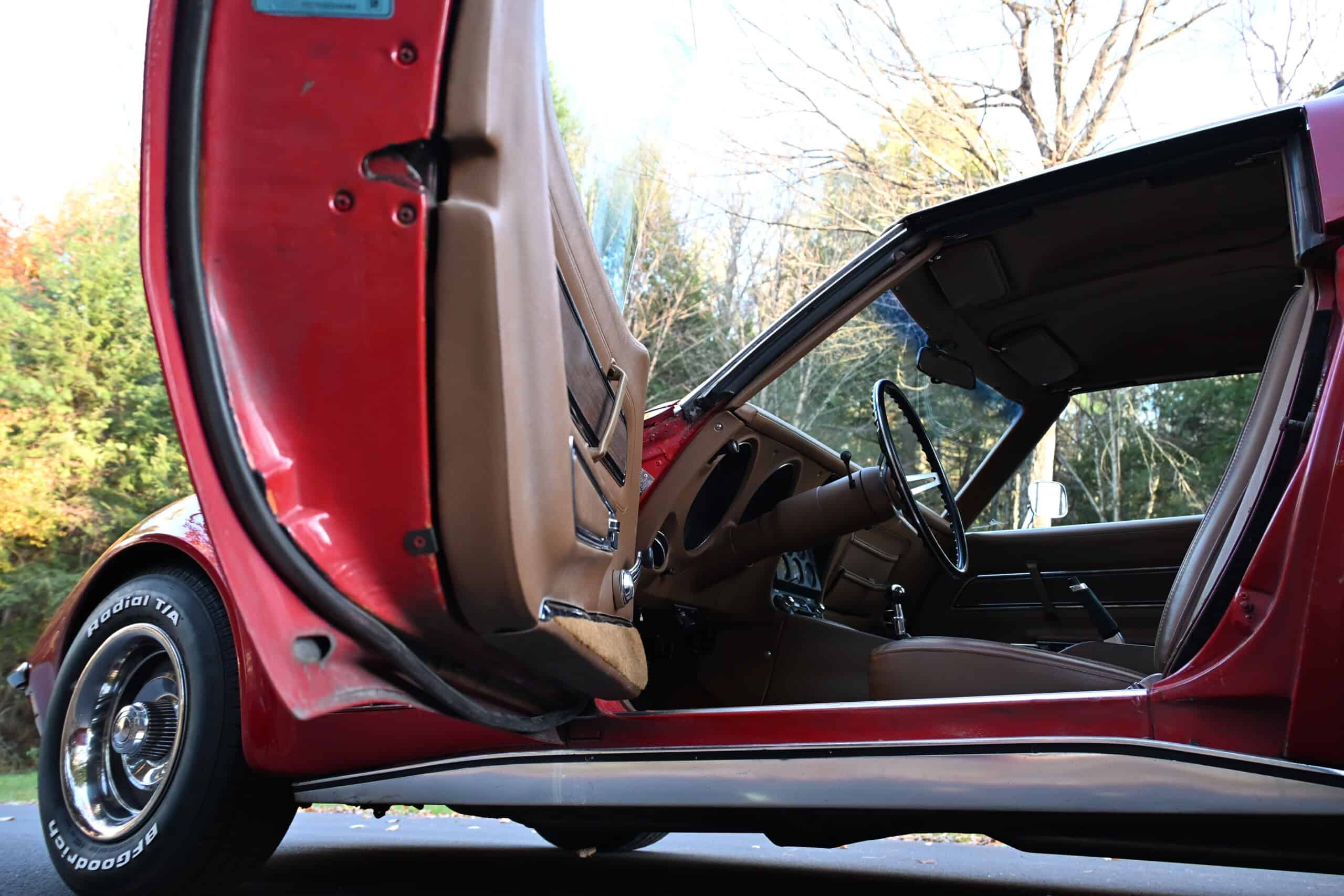 1972 Chevrolet corvette — Interior shot of classic car with open door and dashboard.