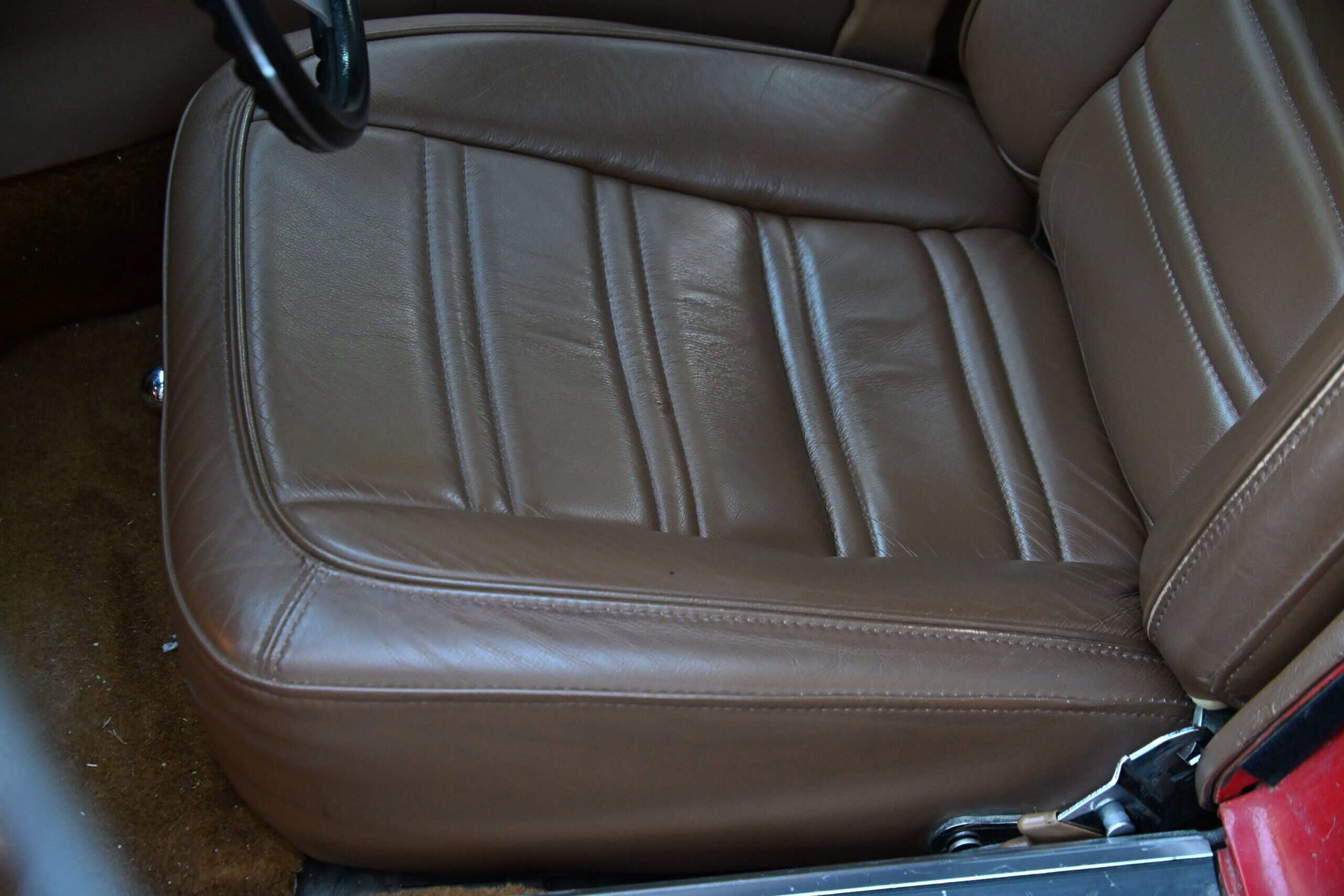 1972 Chevrolet corvette — Close-up of brown leather interior seat in classic car.