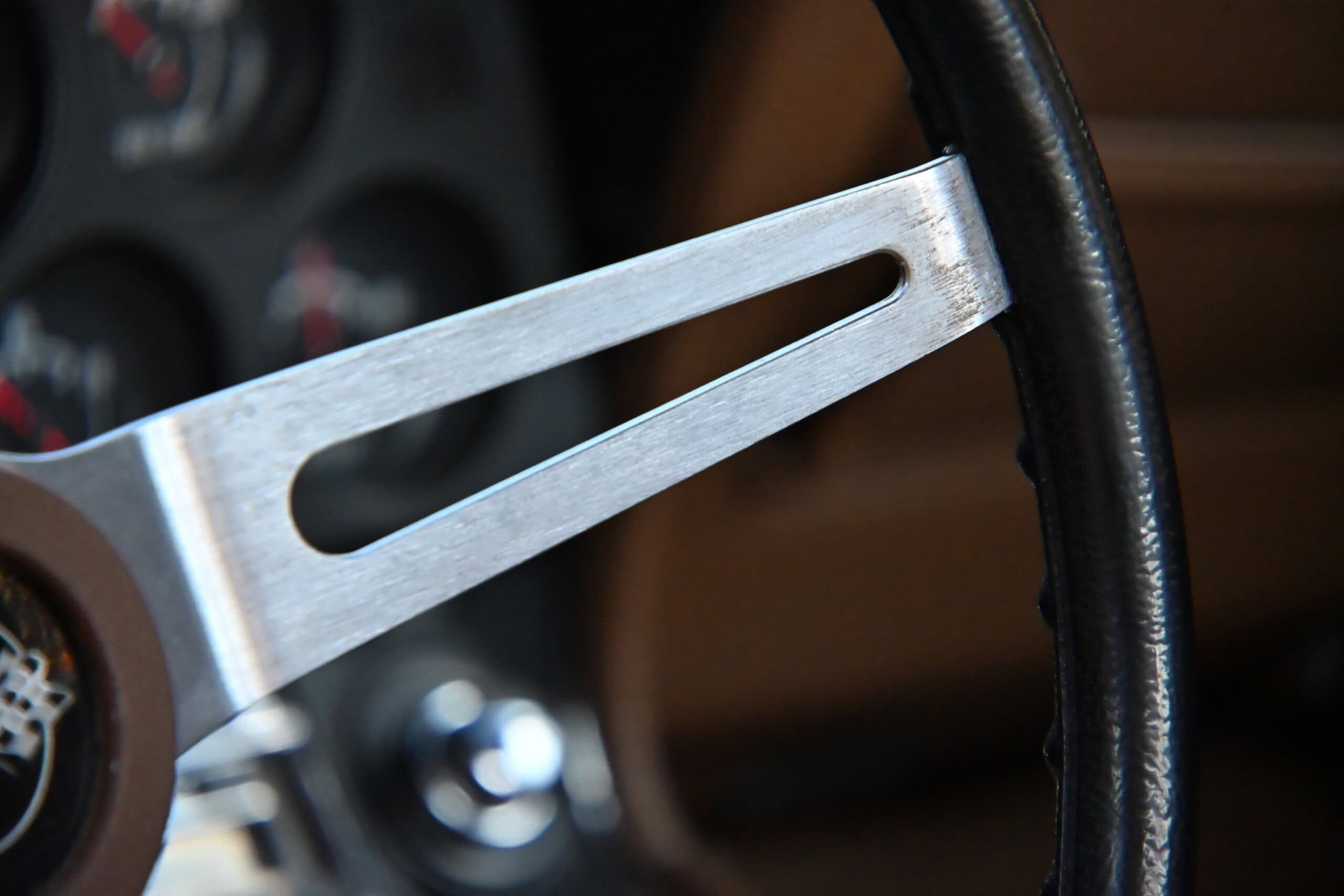1972 Chevrolet corvette — Close-up of classic car steering wheel and dashboard.