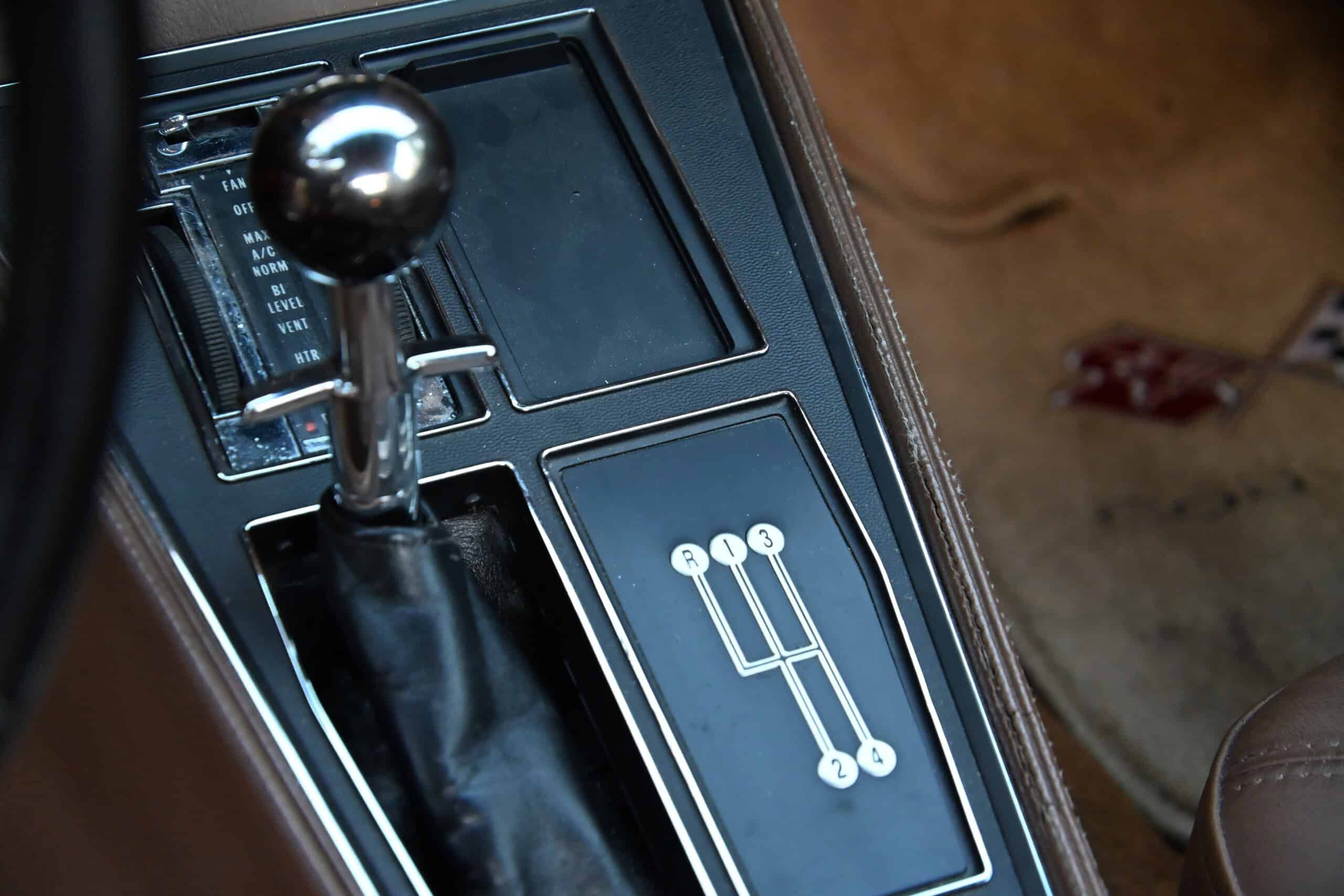 1972 Chevrolet corvette — Close-up of classic car interior showing gear shift and console.