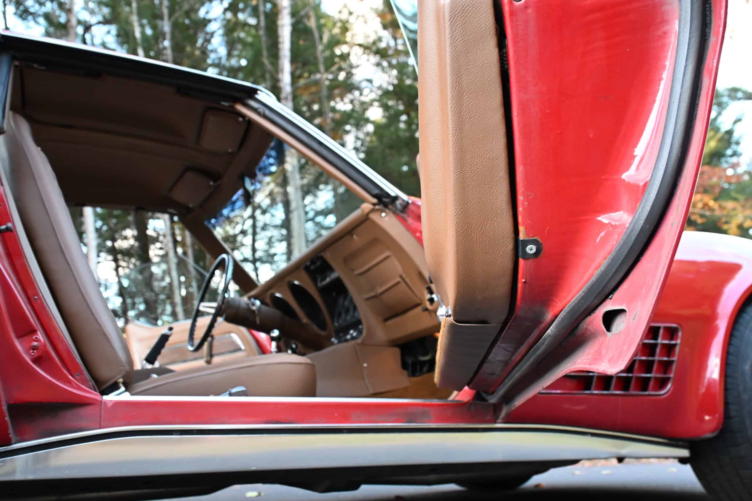 1972 Chevrolet corvette — Interior view of a classic car with open door and dashboard.