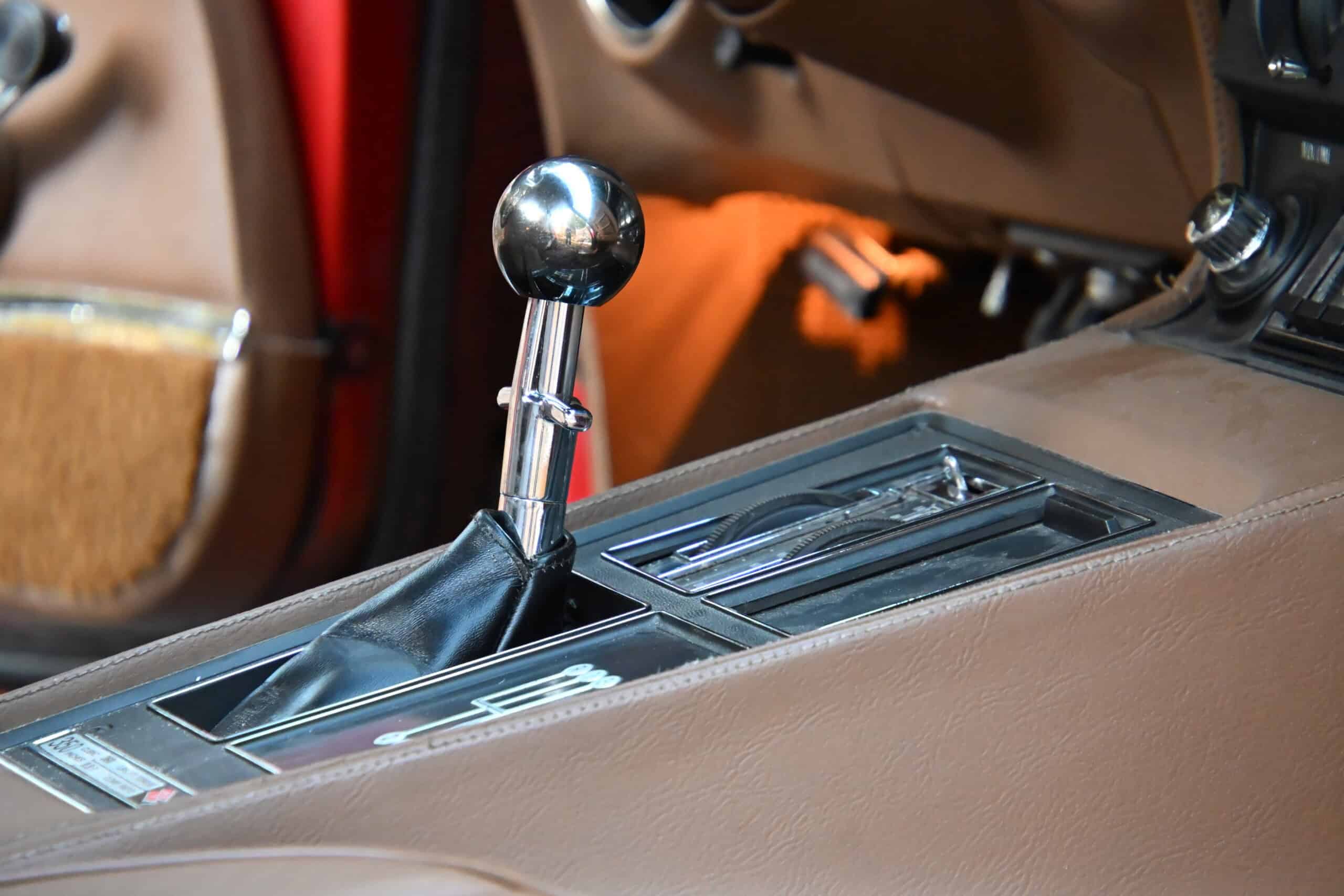 1972 Chevrolet corvette — Close-up of classic car interior with gear shift and console.