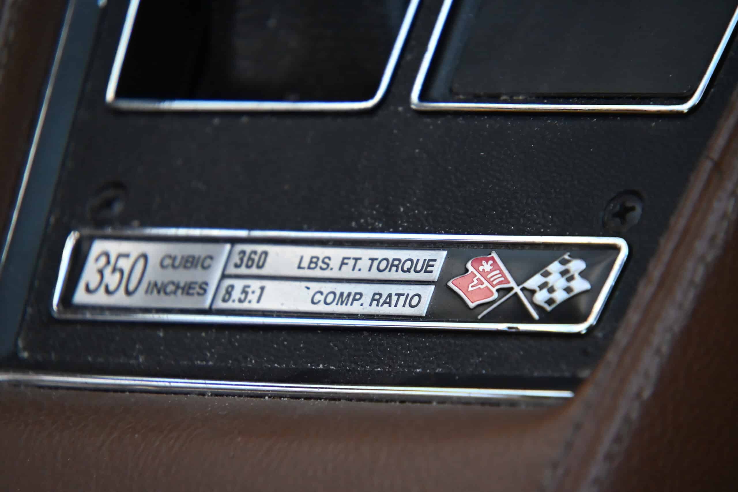 1972 Chevrolet corvette — Close-up of classic car dashboard showing torque and compression ratio.