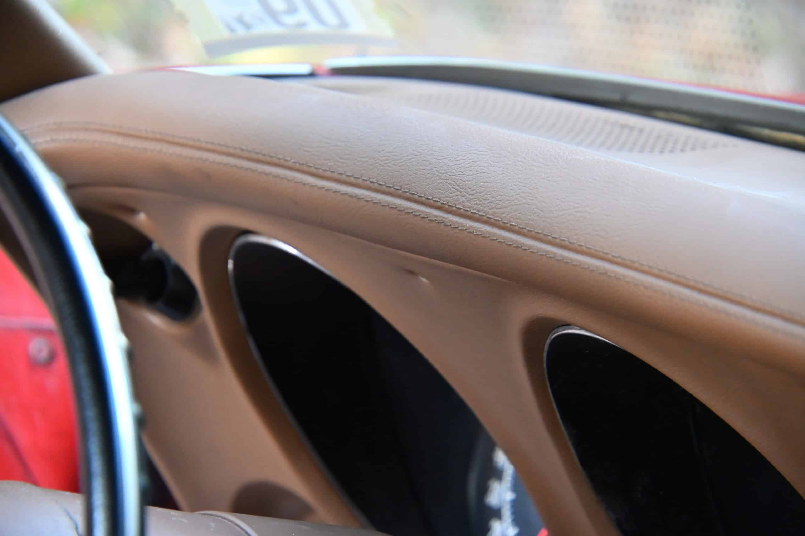 1972 Chevrolet corvette — Close-up of classic car interior dashboard with beige trim and air vents.