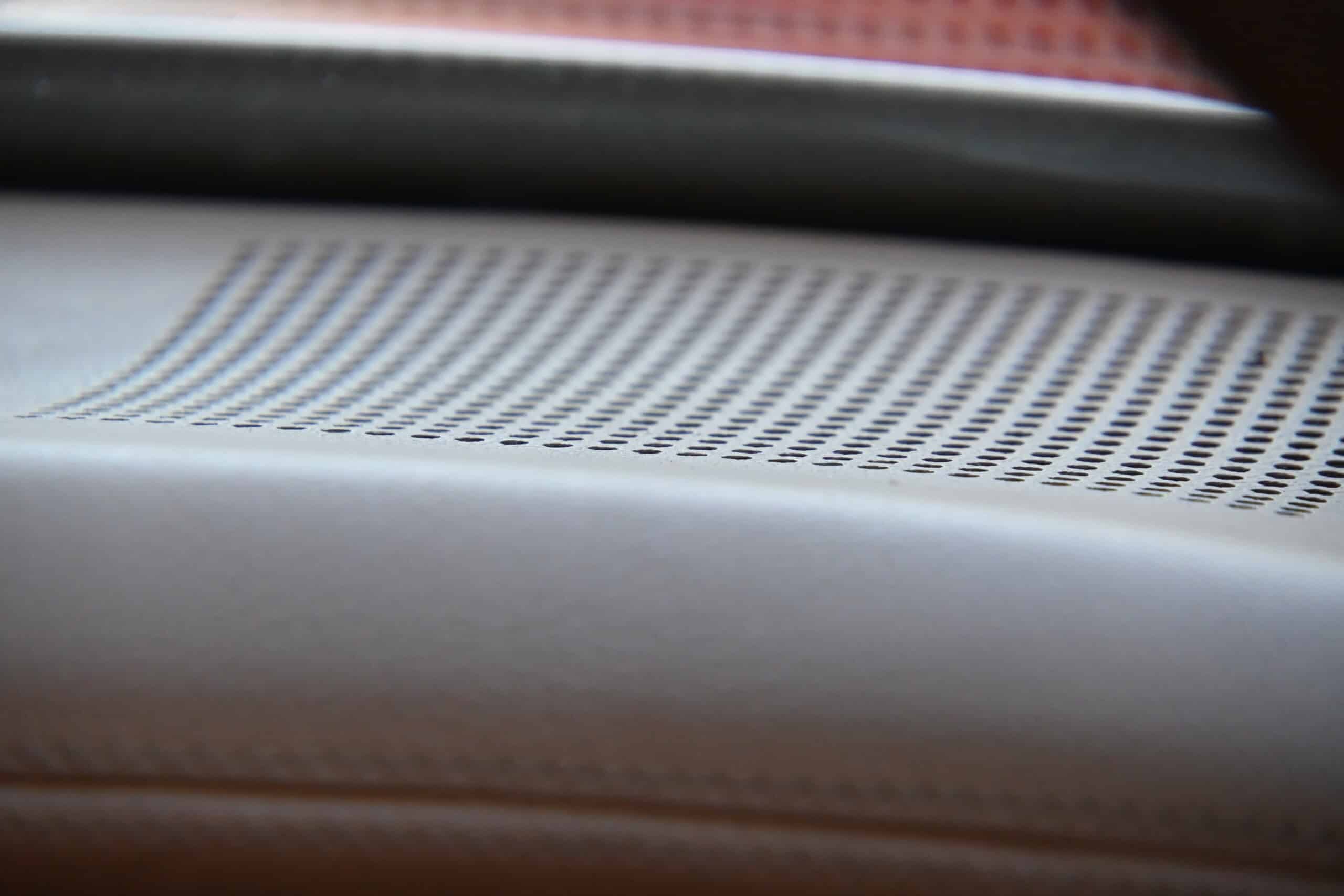 1972 Chevrolet corvette — Close-up of dashboard with speaker grille in classic car interior.
