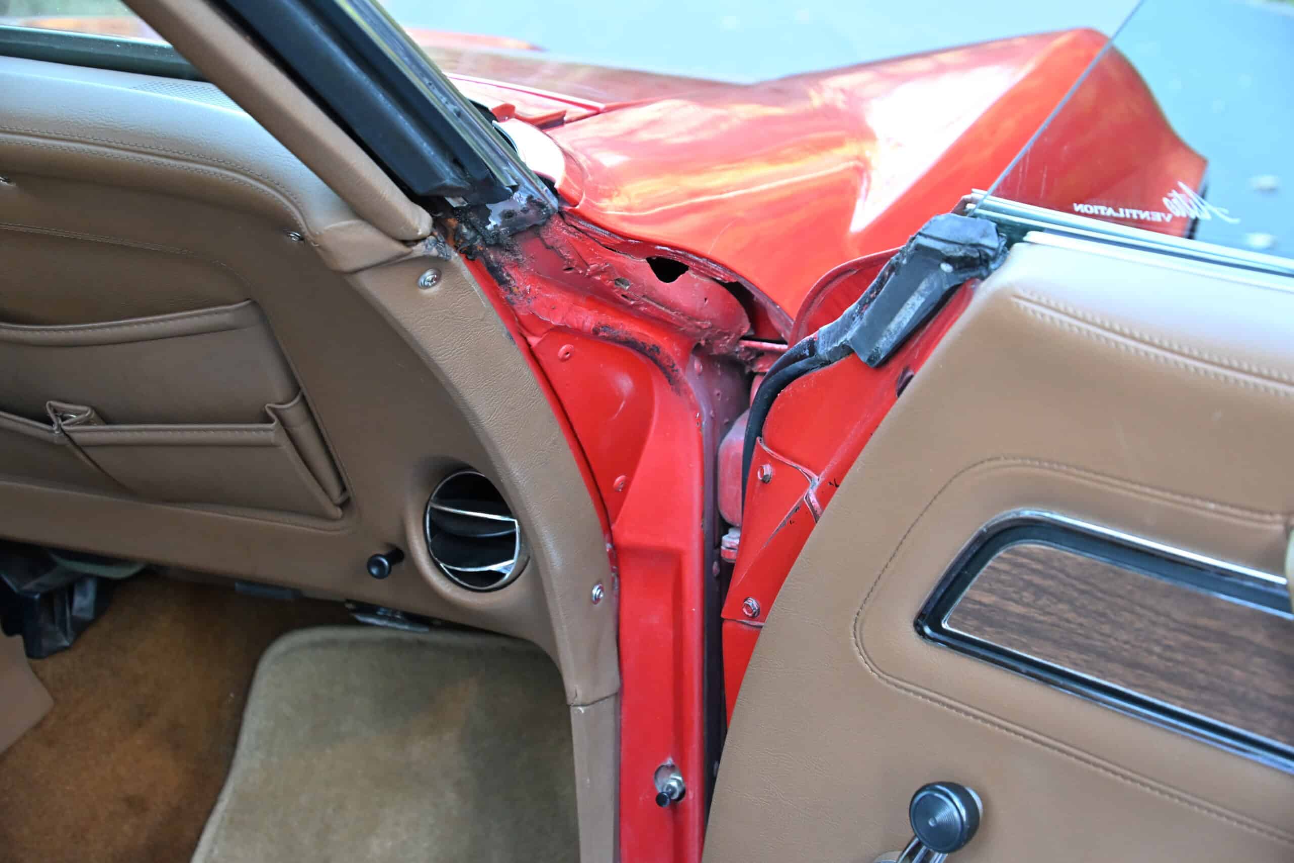 1972 Chevrolet corvette — Interior view of a classic car showing dashboard and door panel.