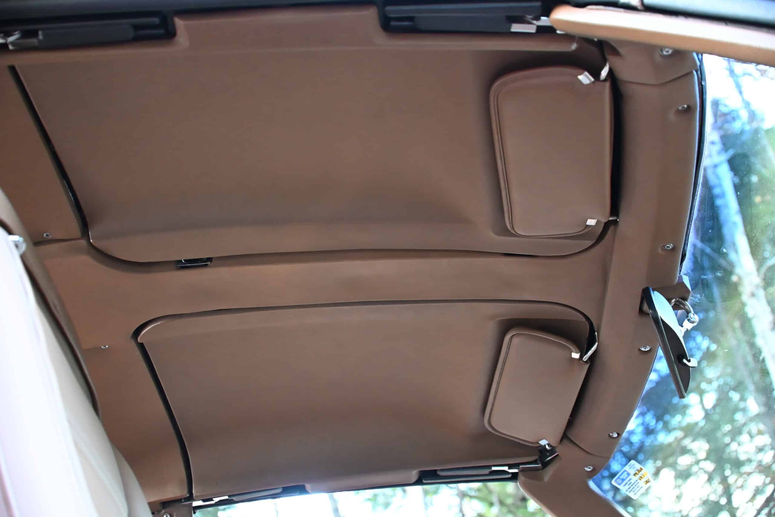 1972 Chevrolet corvette — Interior view of classic car roof with sun visors and headliner.