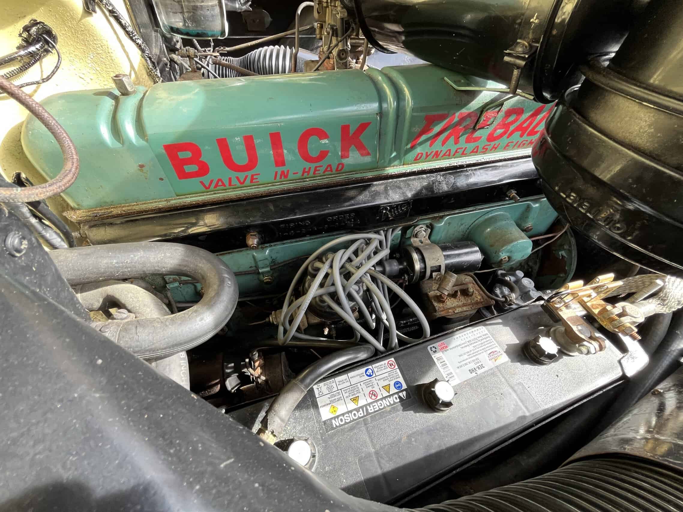 1953 Buick special — Close-up of classic car engine with Buick valve cover and wiring.