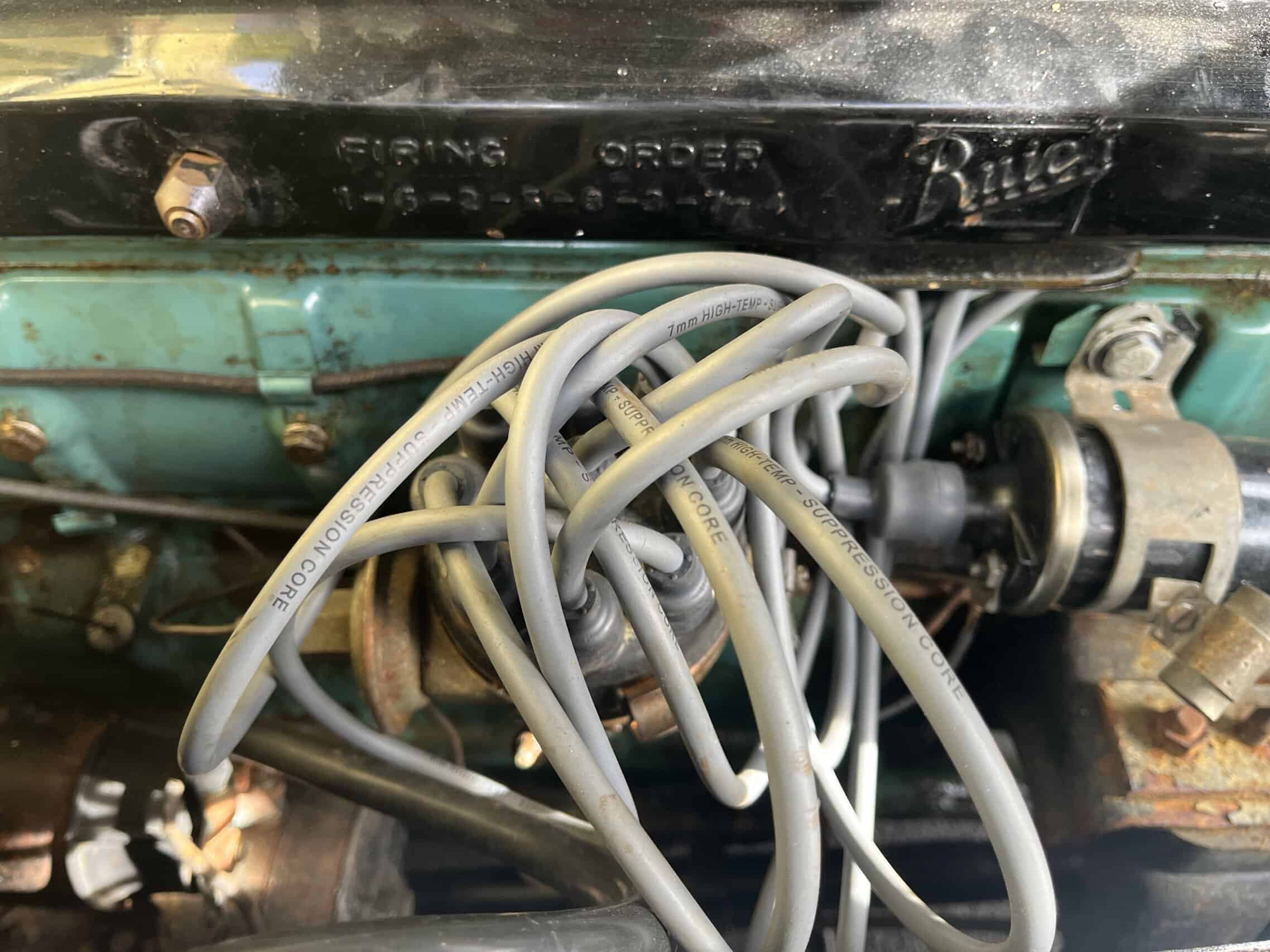1953 Buick special — Close-up of engine wiring and components in a classic car.