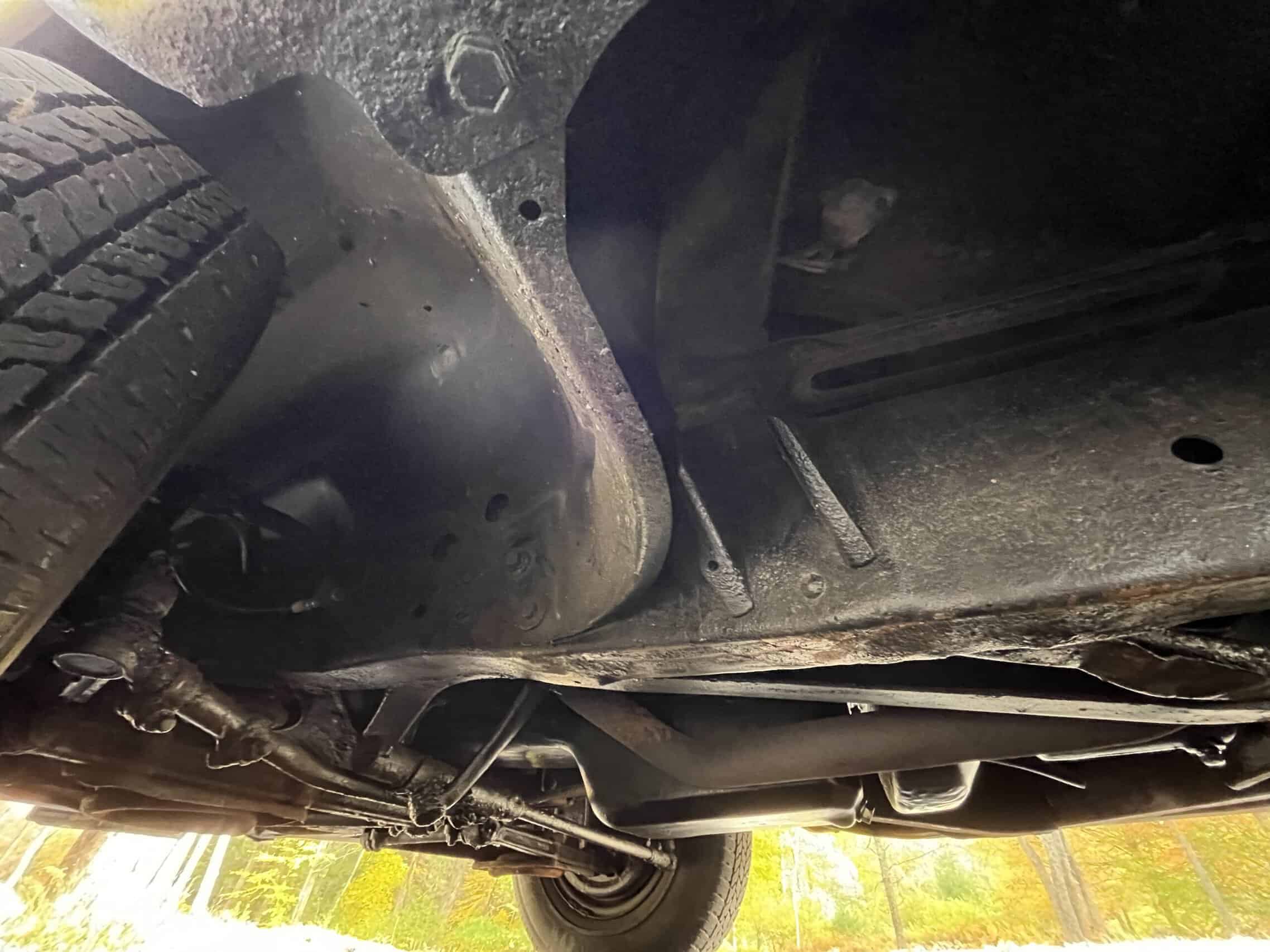 1953 Buick special — Underbody shot of a classic car showing suspension and chassis.
