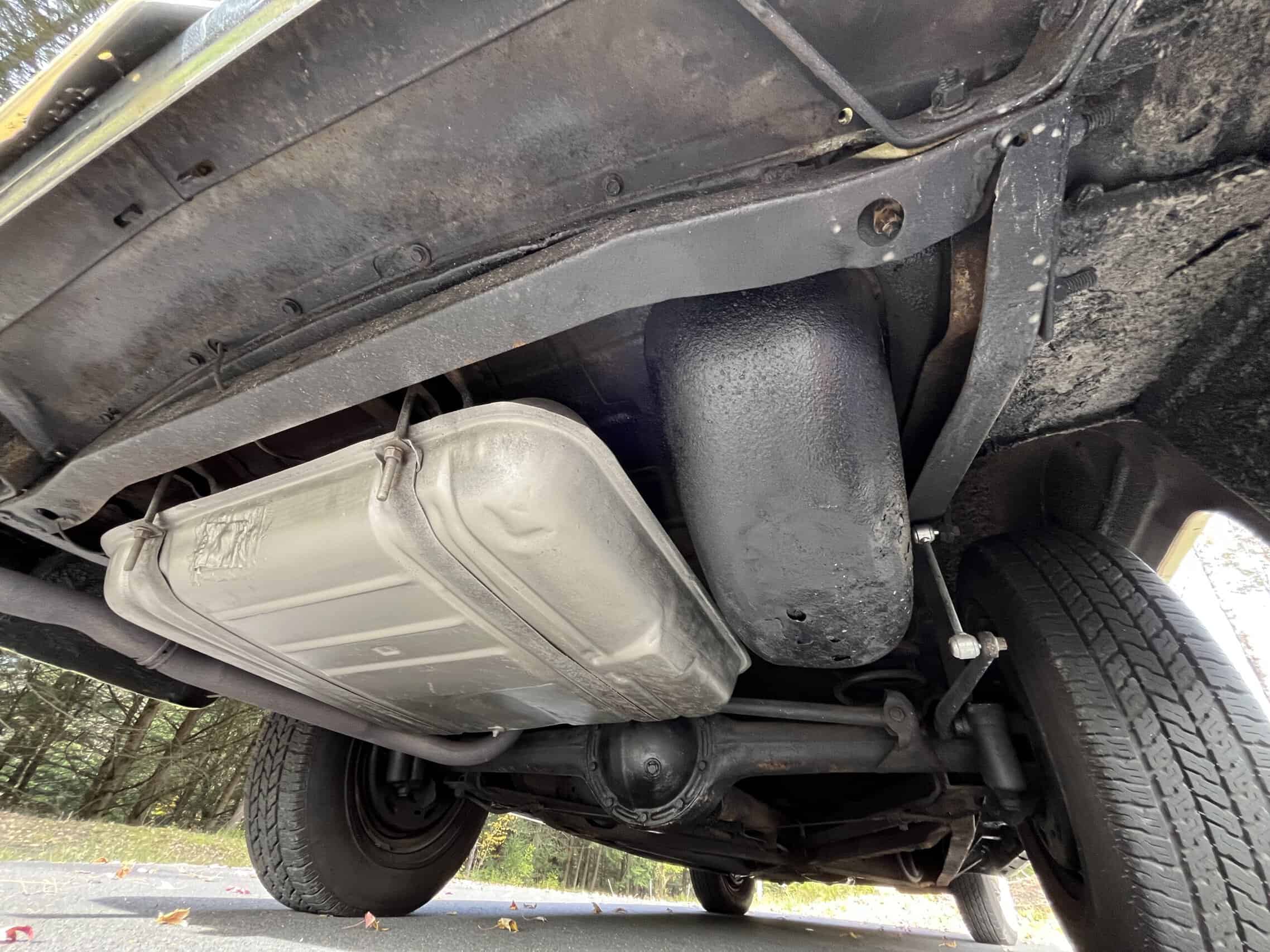 1953 Buick special — Underneath view of classic car showing fuel tank and suspension.