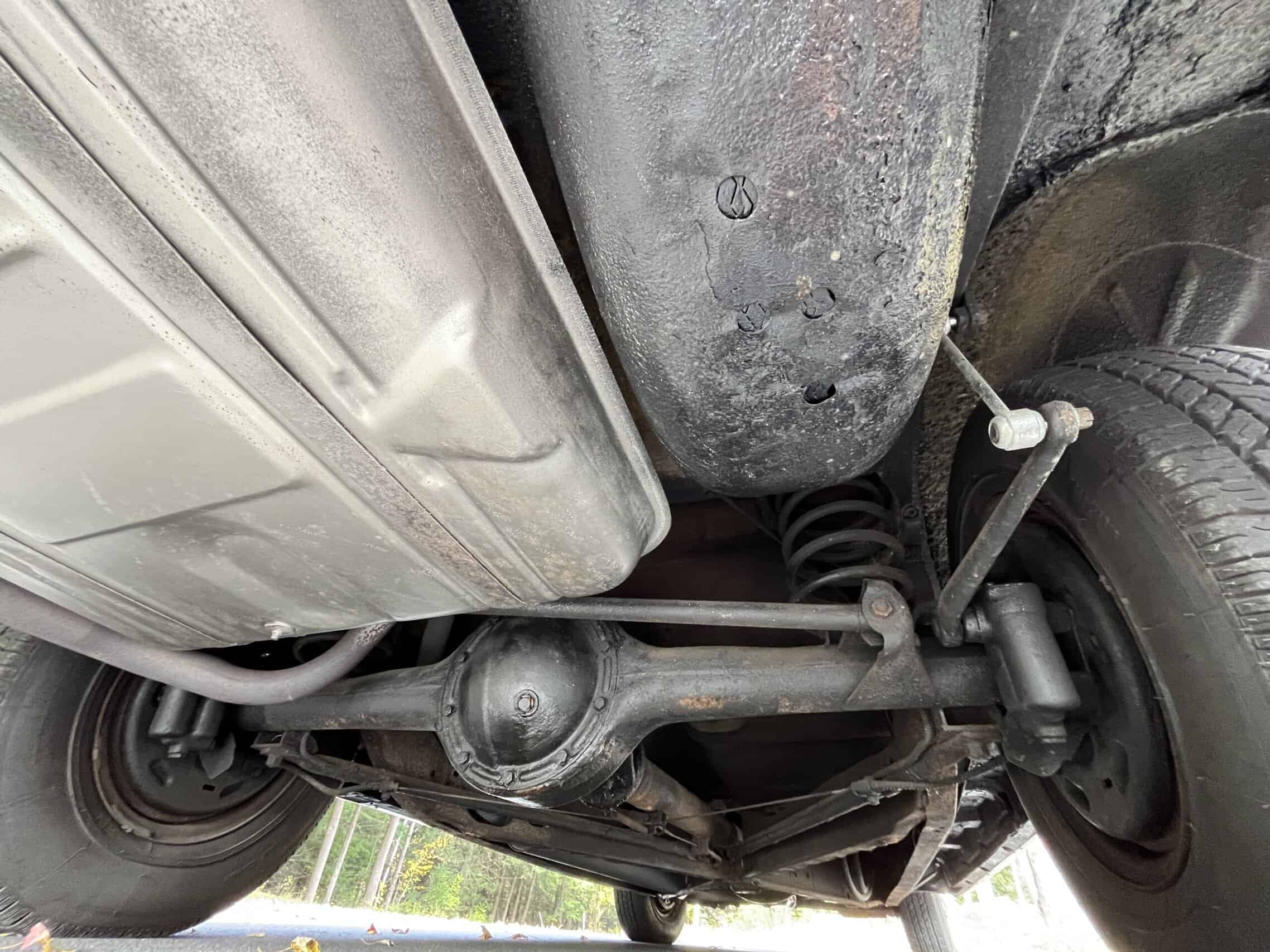 1953 Buick special — View of the underside of a classic car showing suspension and axle.