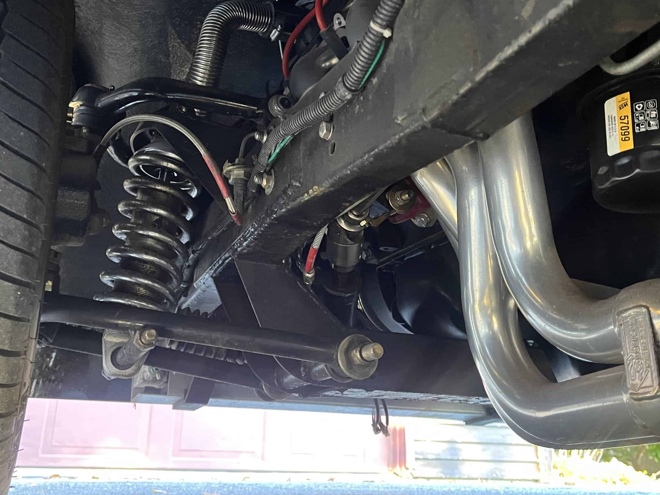 1941 Willys Custom Street Rod — Detail of suspension and exhaust system in classic car.