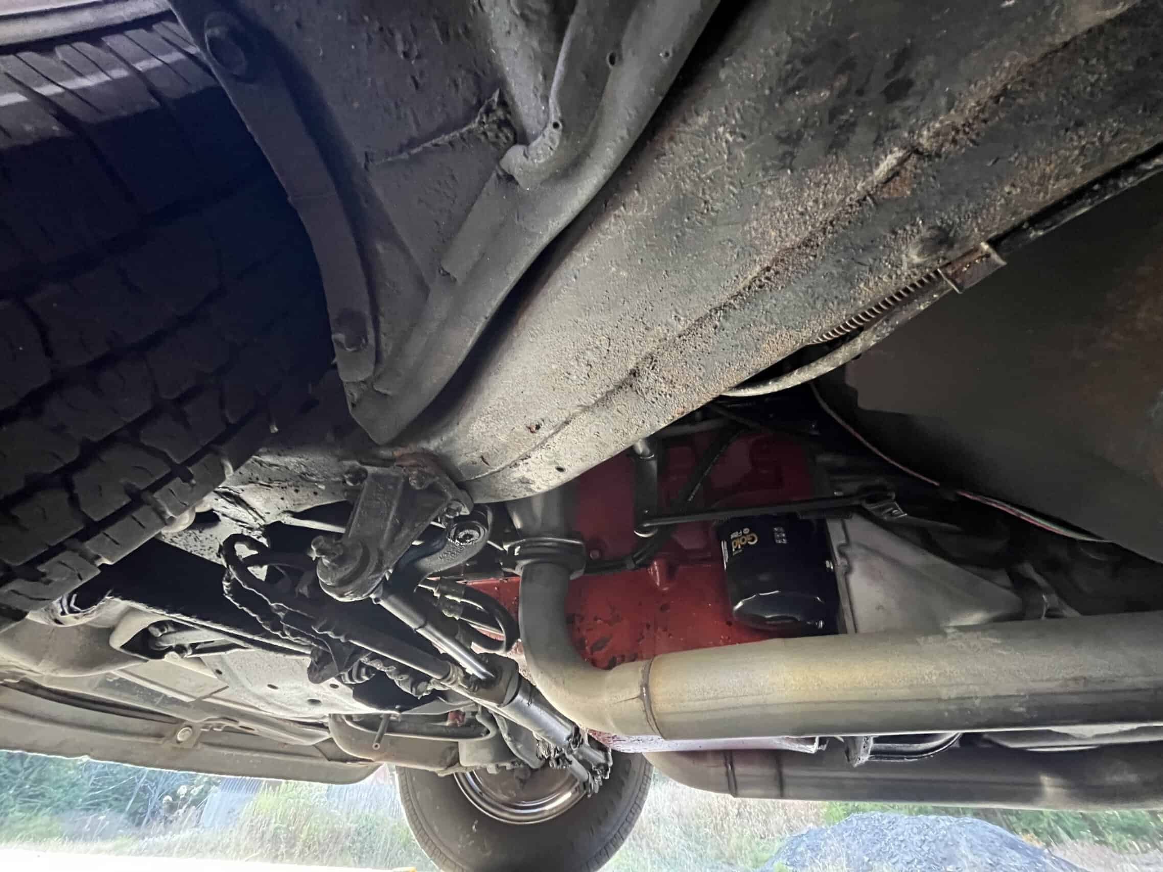 1972 Chevrolet corvette — Underneath view of a classic car showing engine and exhaust system.