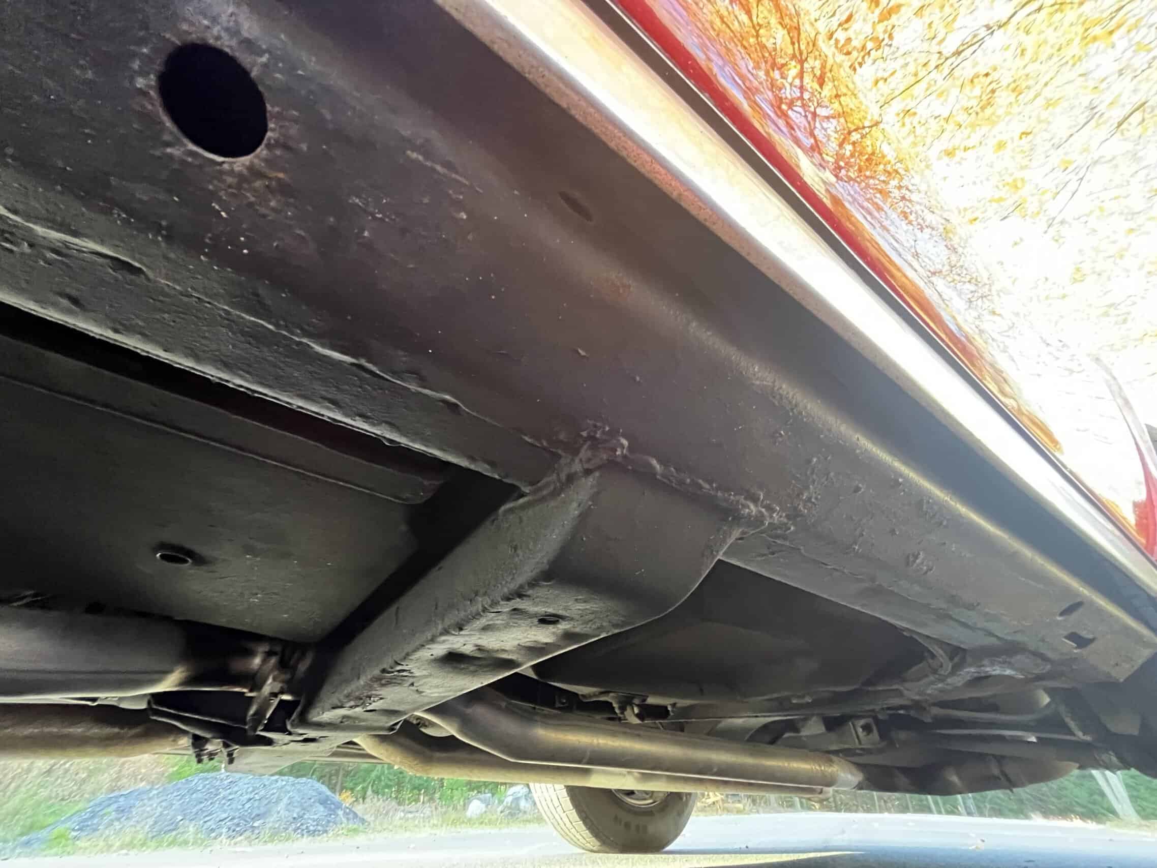 1972 Chevrolet corvette — View of the underside of a classic car showing exhaust and chassis.