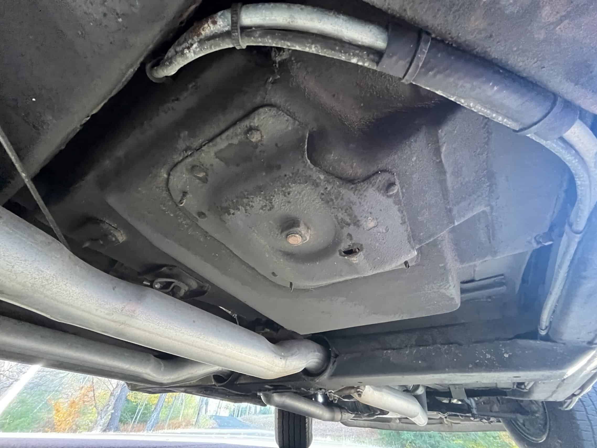 1972 Chevrolet corvette — Underbody shot of a classic car showing oil pan and exhaust system.