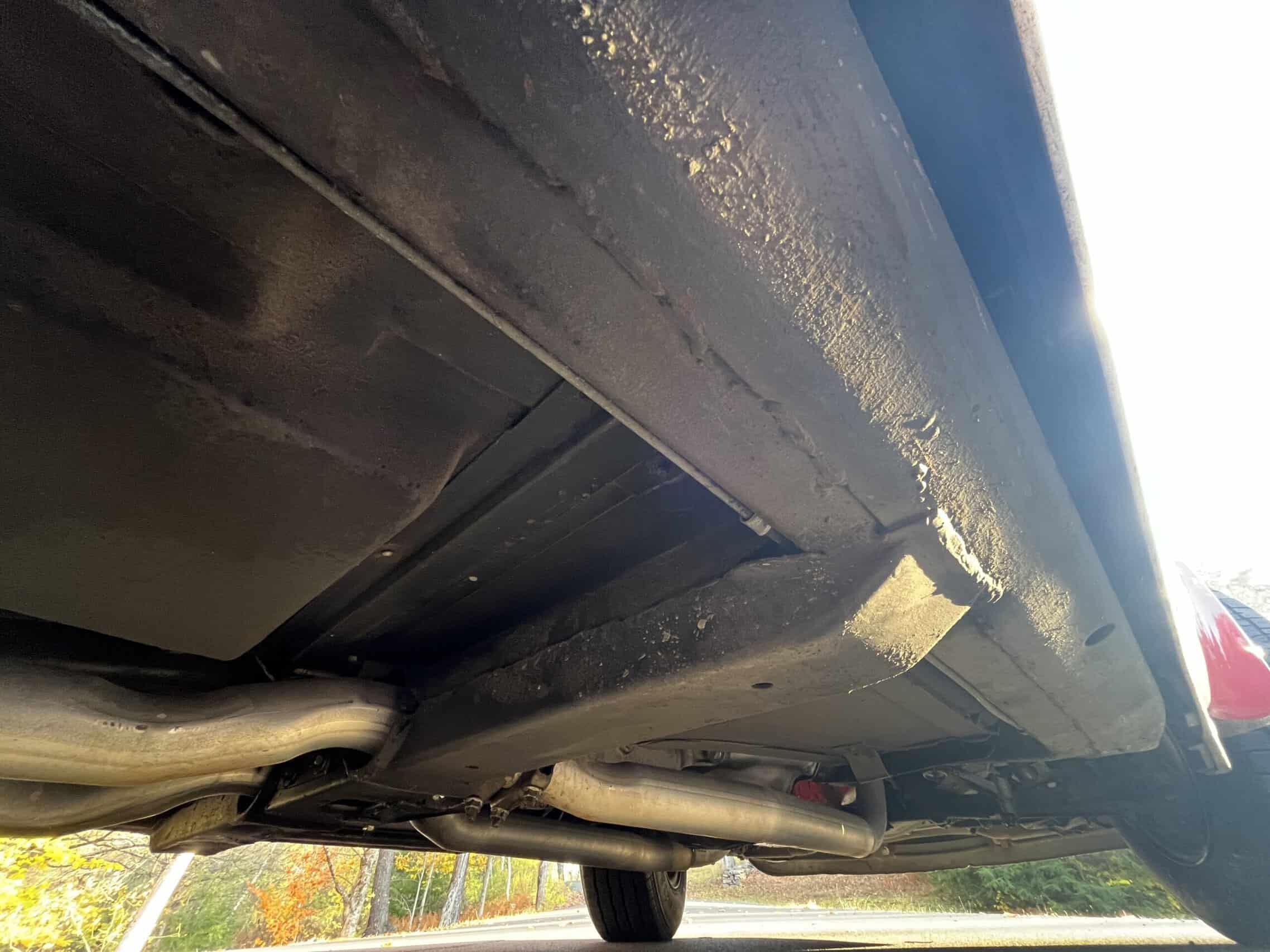 1972 Chevrolet corvette — View of the underside of a classic car showing exhaust system and chassis.